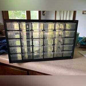 Multi-use plastic cabinet with 30 drawers.